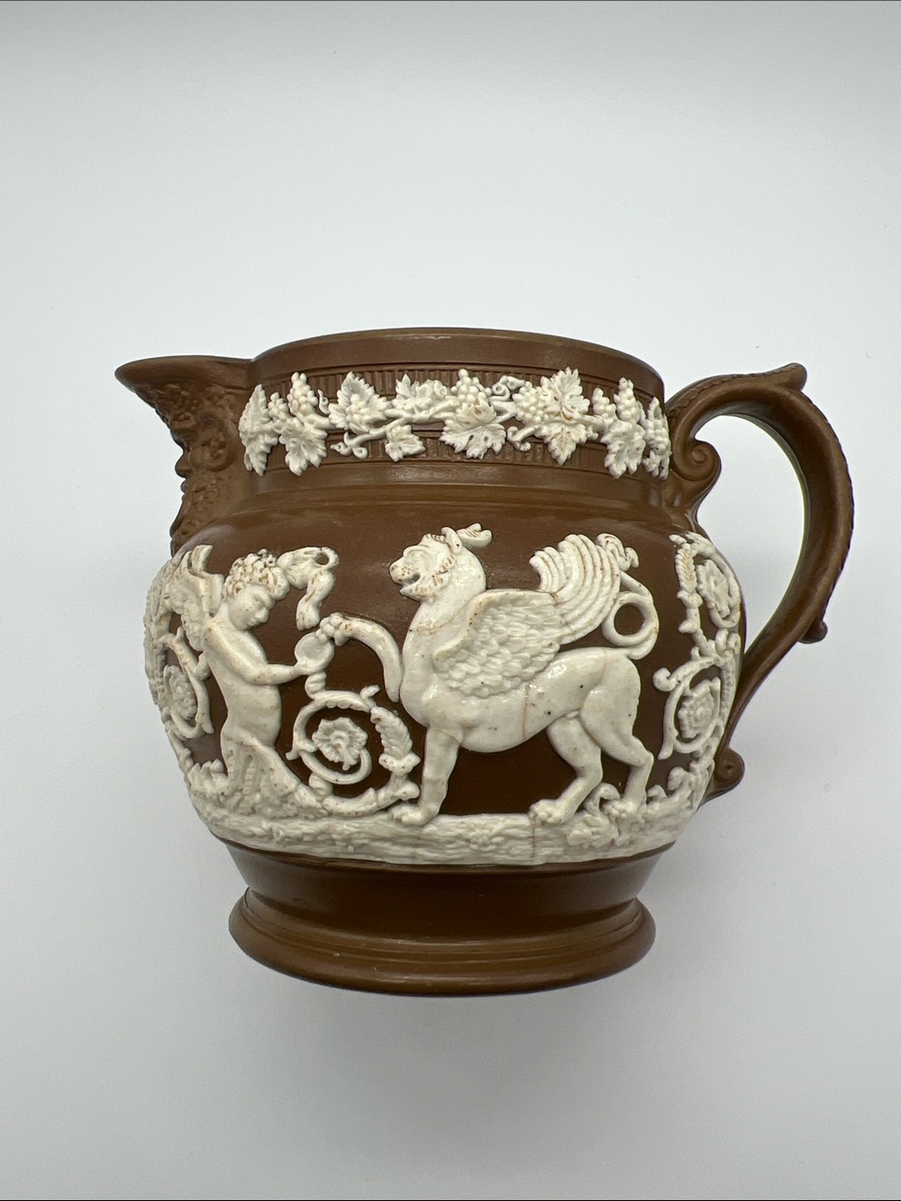 Antique Brown and Cream Griffin & Cherub Decorative Art Creamer, 4”